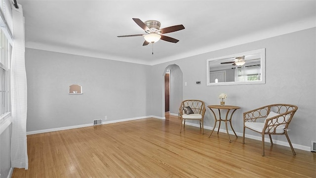 900 N Whitmore Rd, North Huntingdon, PA 15642 - sitting room with arched walkways, ceiling fan, and light wood-type flooring