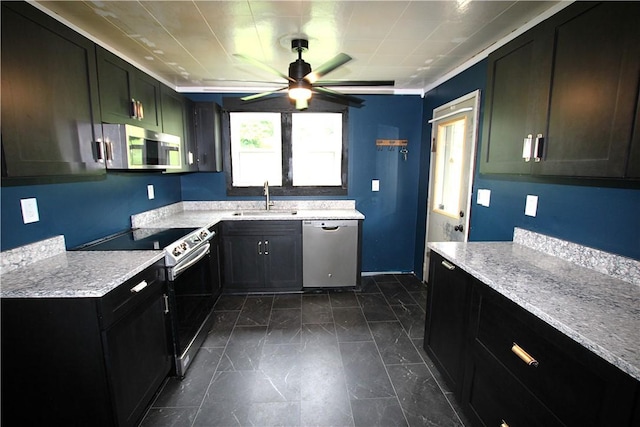 216 Duffy Dr, Moon/Crescent Twp, PA 15108 - kitchen featuring stainless steel appliances, a ceiling fan, and dark cabinets