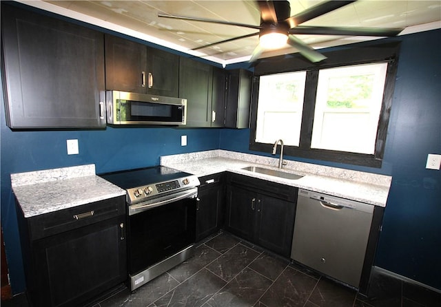216 Duffy Dr, Moon/Crescent Twp, PA 15108 - kitchen with appliances with stainless steel finishes, dark marble finish floors, light countertops, and a ceiling fan