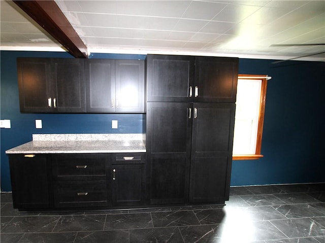 216 Duffy Dr, Moon/Crescent Twp, PA 15108 - kitchen featuring beam ceiling, dark marble finish flooring, and light stone countertops