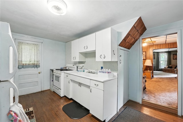 339 E Market St, Mercer Boro, PA 16137 - kitchen featuring white appliances, dark wood-style flooring, light countertops, white cabinets, and tasteful backsplash