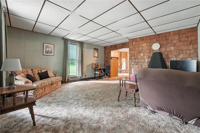 339 E Market St, Mercer Boro, PA 16137 - carpeted living room featuring a drop ceiling, wooden walls, and an office area