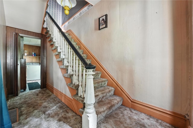 339 E Market St, Mercer Boro, PA 16137 - stairway featuring carpet flooring, washer / clothes dryer, and wood walls