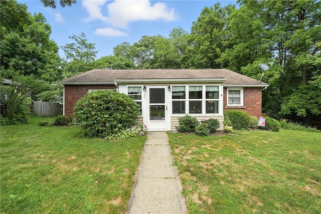 231 E N St, Mercer Boro, PA 16137 - view of front of home with brick siding and roof with shingles