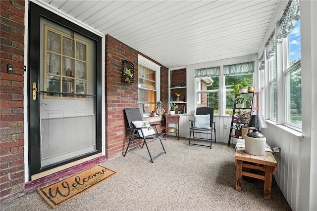 231 E N St, Mercer Boro, PA 16137 - sunroom featuring carpet, brick wall, and wooden ceiling