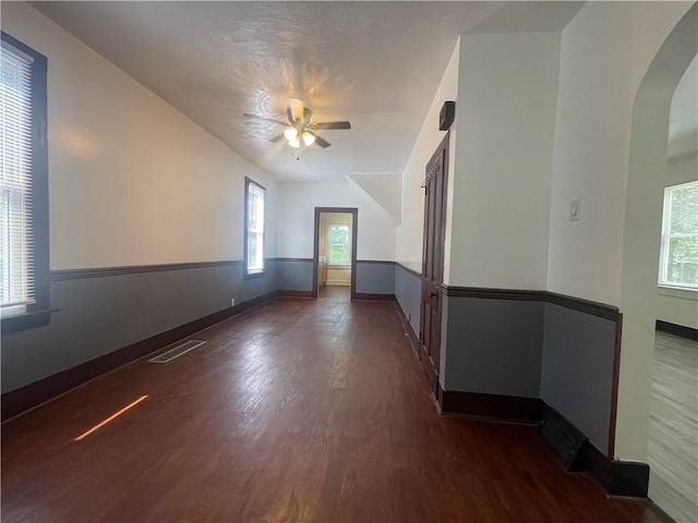 721 Center Ave, City Of But Se, PA 16001 - unfurnished room with ceiling fan, dark wood-style flooring, and arched walkways