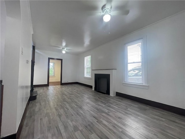 721 Center Ave, City Of But Se, PA 16001 - unfurnished living room with ceiling fan, wood finished floors, a fireplace, and crown molding