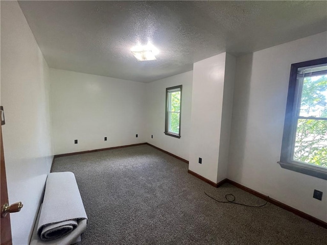 721 Center Ave, City Of But Se, PA 16001 - carpeted empty room featuring healthy amount of natural light and a textured ceiling