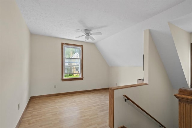 849 Hiland Ave, Coraopolis, PA 15108 - bonus room with light wood-style flooring, a ceiling fan, vaulted ceiling, and a textured ceiling
