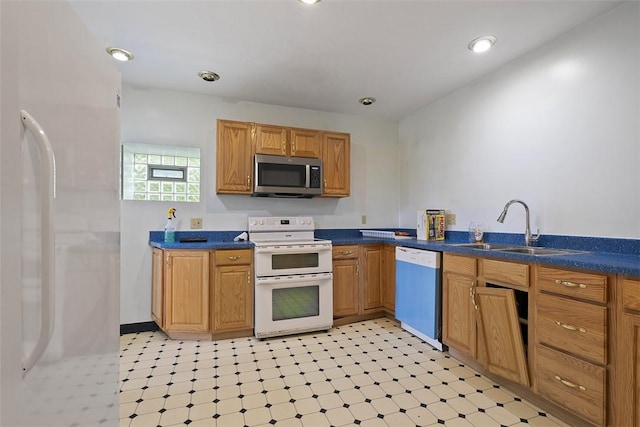 849 Hiland Ave, Coraopolis, PA 15108 - kitchen featuring white appliances, dark countertops, light floors, and recessed lighting