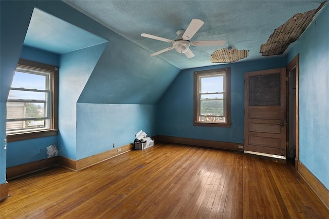 849 Hiland Ave, Coraopolis, PA 15108 - additional living space featuring hardwood / wood-style flooring, vaulted ceiling, ceiling fan, and a textured ceiling