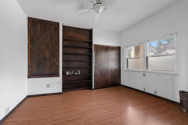 849 Hiland Ave, Coraopolis, PA 15108 - unfurnished bedroom with wood finished floors and ceiling fan