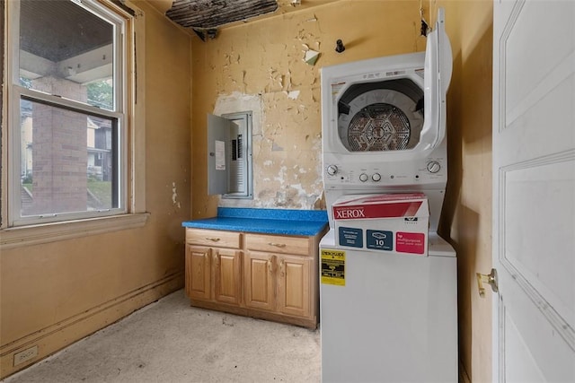 849 Hiland Ave, Coraopolis, PA 15108 - laundry area featuring stacked washer and clothes dryer, electric panel, and plenty of natural light