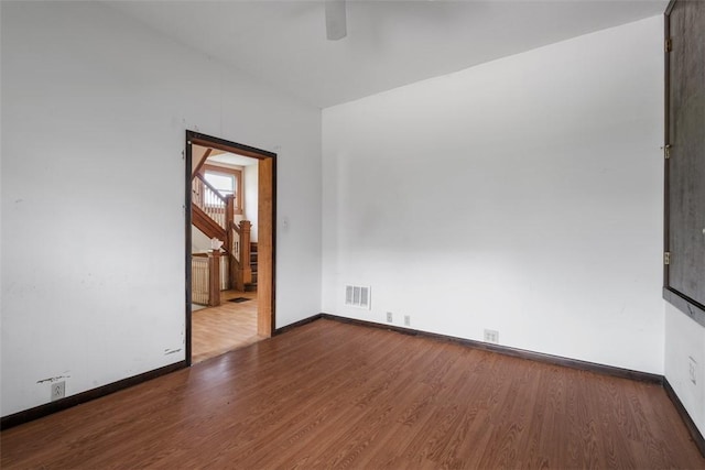 849 Hiland Ave, Coraopolis, PA 15108 - unfurnished room featuring wood finished floors, a ceiling fan, and stairway