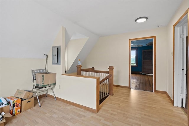 849 Hiland Ave, Coraopolis, PA 15108 - hall with electric panel, light wood-style floors, an upstairs landing, and vaulted ceiling