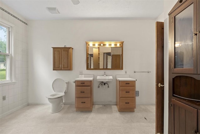 849 Hiland Ave, Coraopolis, PA 15108 - bathroom with healthy amount of natural light, vanity, and tile patterned floors
