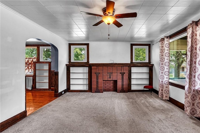 200 38th St, Beaver Falls, PA 15010 - unfurnished living room with carpet floors, healthy amount of natural light, arched walkways, and ceiling fan