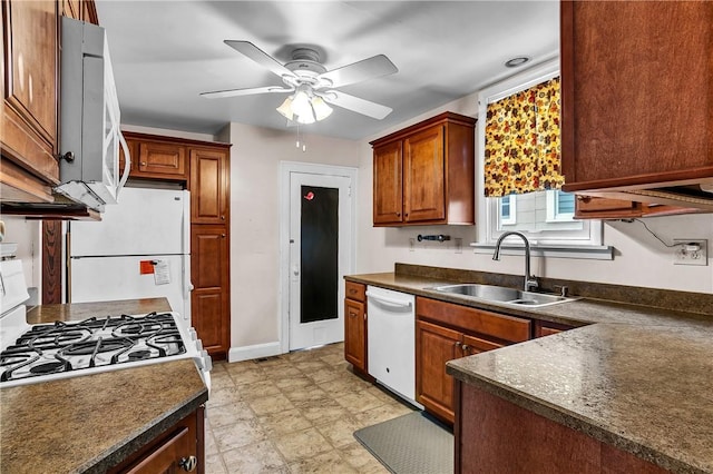 200 38th St, Beaver Falls, PA 15010 - kitchen featuring white appliances, dark countertops, ceiling fan, and brown cabinetry
