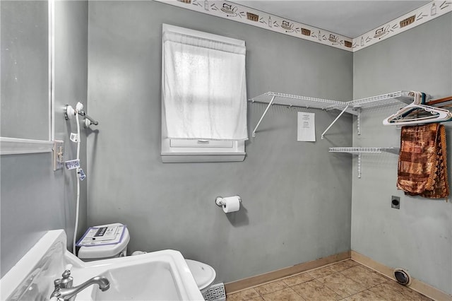 200 38th St, Beaver Falls, PA 15010 - bathroom with baseboards and tile patterned flooring