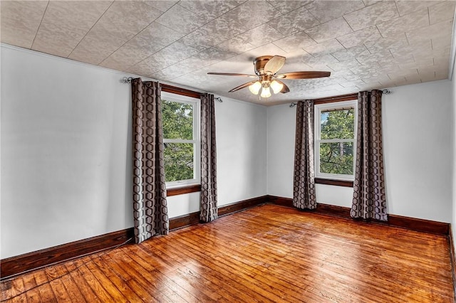 200 38th St, Beaver Falls, PA 15010 - empty room with hardwood / wood-style floors, healthy amount of natural light, and ceiling fan