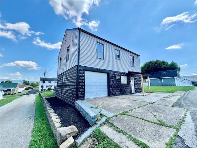 26 Wilmac St, South Union Twp, PA 15401 - view of side of property featuring driveway, an attached garage, and a yard