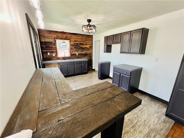 26 Wilmac St, South Union Twp, PA 15401 - kitchen with light wood finished floors, open shelves, a textured ceiling, and dark brown cabinets