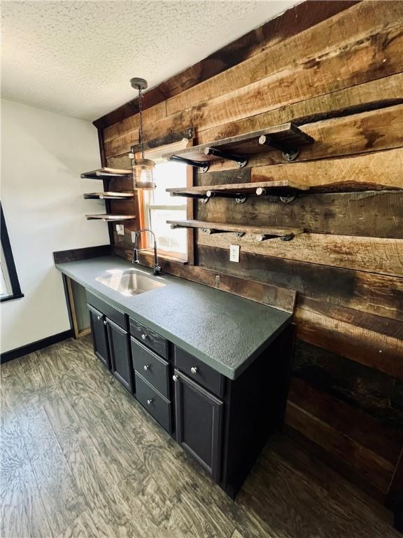 26 Wilmac St, South Union Twp, PA 15401 - unfurnished office featuring wooden walls, dark wood-type flooring, and a textured ceiling