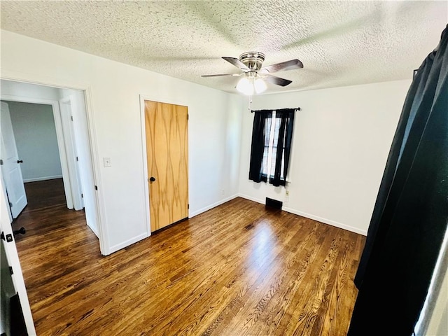 26 Wilmac St, South Union Twp, PA 15401 - unfurnished bedroom featuring wood finished floors, ceiling fan, a textured ceiling, and a closet