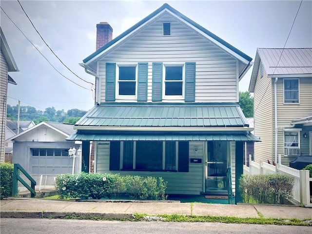 1017 Johnston Ave, Kittanning Boro, PA 16201 - view of front of property with a chimney, a metal roof, board and batten siding, an attached garage, and cooling unit