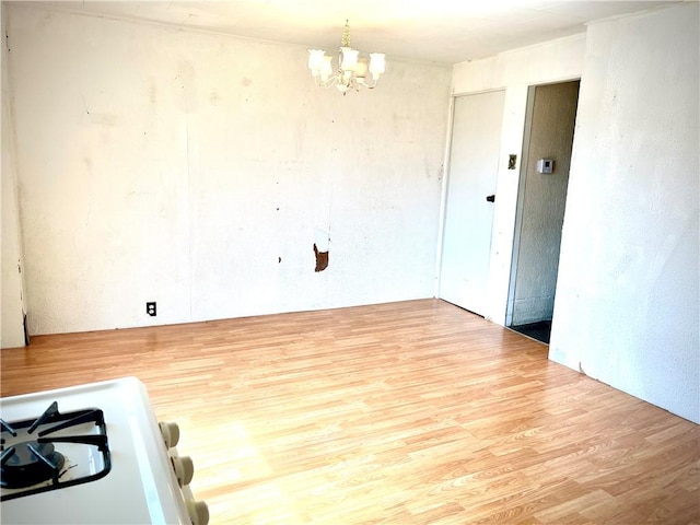 1017 Johnston Ave, Kittanning Boro, PA 16201 - spare room featuring wood finished floors and a chandelier