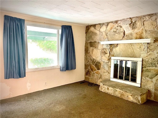 1017 Johnston Ave, Kittanning Boro, PA 16201 - unfurnished living room featuring carpet floors, crown molding, and a stone fireplace