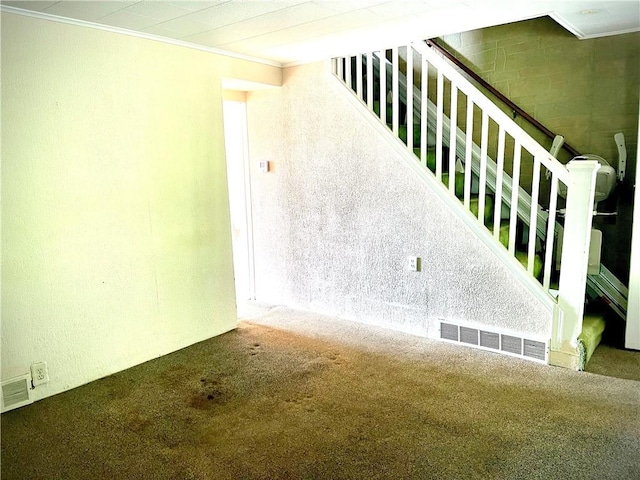 1017 Johnston Ave, Kittanning Boro, PA 16201 - unfurnished living room featuring ornamental molding, carpet flooring, and stairs