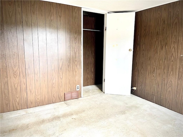1017 Johnston Ave, Kittanning Boro, PA 16201 - unfurnished bedroom featuring carpet floors, wood walls, and a closet