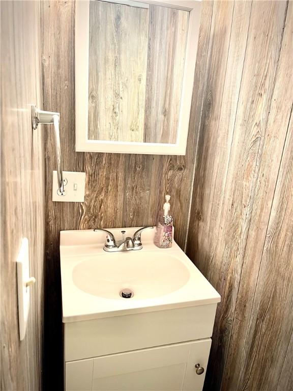 1017 Johnston Ave, Kittanning Boro, PA 16201 - bathroom featuring vanity and wood walls