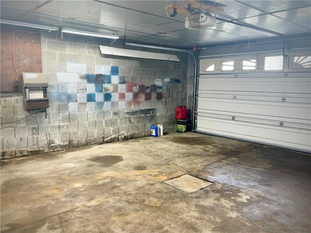 1017 Johnston Ave, Kittanning Boro, PA 16201 - garage featuring a garage door opener and concrete block wall