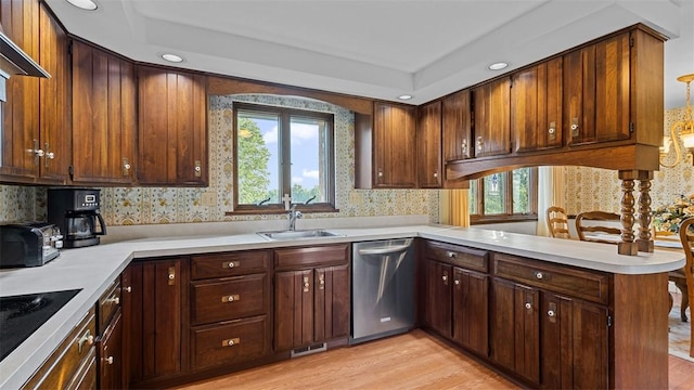 11 Sunnycrest Dr, Cecil, PA 15321 - kitchen with stainless steel dishwasher, wallpapered walls, a peninsula, light countertops, and light wood-style floors
