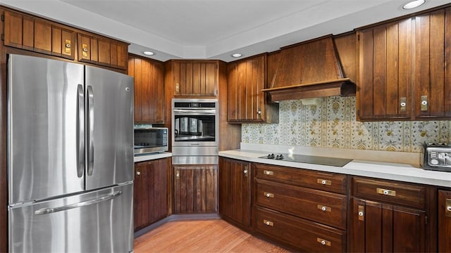 11 Sunnycrest Dr, Cecil, PA 15321 - kitchen featuring appliances with stainless steel finishes, light countertops, and light wood-style floors