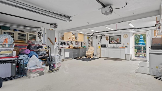 11 Sunnycrest Dr, Cecil, PA 15321 - garage with a garage door opener and water heater