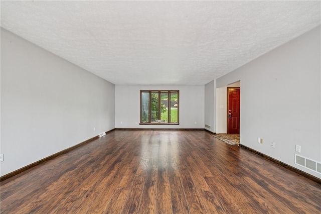 1556 Washington Rd, Washington Twp, PA 15613 - empty room with dark wood-style flooring and a textured ceiling