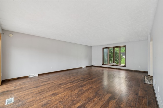 1556 Washington Rd, Washington Twp, PA 15613 - unfurnished room featuring hardwood / wood-style floors, a textured ceiling, and a smoke detector
