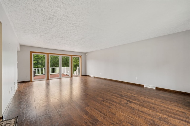 1556 Washington Rd, Washington Twp, PA 15613 - spare room featuring hardwood / wood-style floors and a textured ceiling