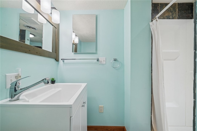 1556 Washington Rd, Washington Twp, PA 15613 - bathroom featuring vanity, a textured ceiling, and a shower with shower curtain