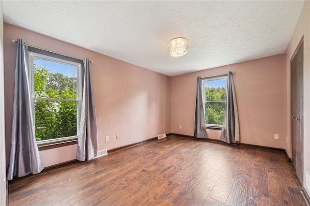 1556 Washington Rd, Washington Twp, PA 15613 - unfurnished room with hardwood / wood-style floors and a textured ceiling