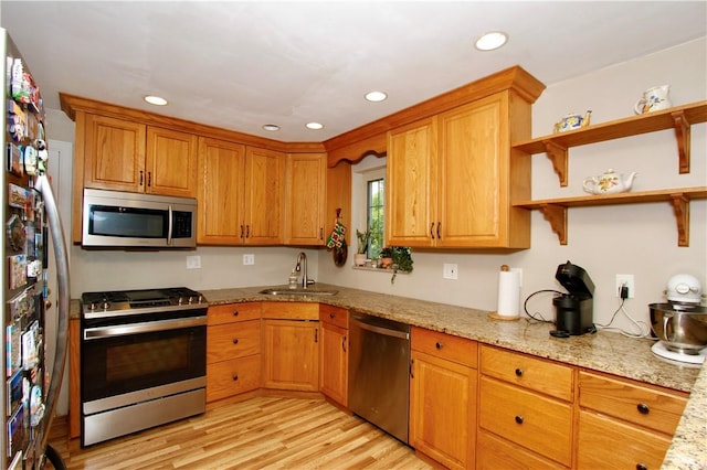 731 Kewanna Ave, Mt Lebanon, PA 15234 - kitchen with appliances with stainless steel finishes, recessed lighting, light stone countertops, light wood-type flooring, and brown cabinets