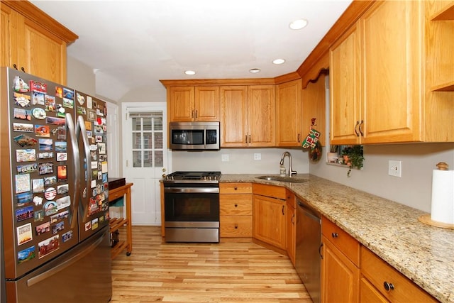 731 Kewanna Ave, Mt Lebanon, PA 15234 - kitchen featuring appliances with stainless steel finishes, light wood-style flooring, recessed lighting, light stone countertops, and brown cabinetry