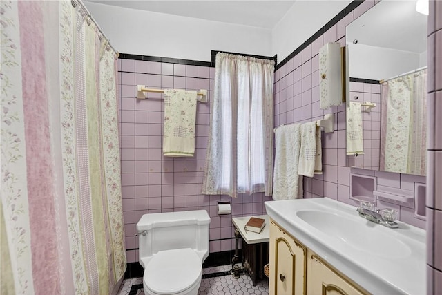 510 7th St, Patterson Heights, PA 15010 - bathroom with vanity, tile walls, tile patterned floors, and curtained shower