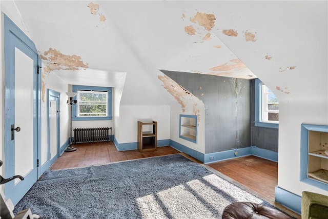 510 7th St, Patterson Heights, PA 15010 - bonus room with wood finished floors, healthy amount of natural light, radiator heating unit, and vaulted ceiling