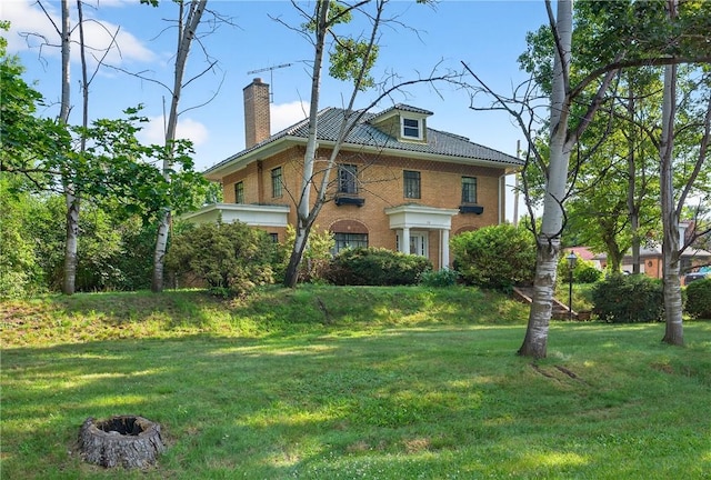 510 7th St, Patterson Heights, PA 15010 - view of front of home featuring a chimney, brick siding, and a front yard