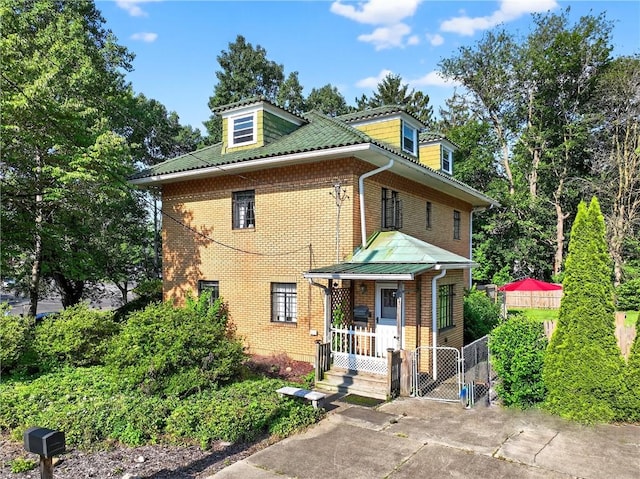 510 7th St, Patterson Heights, PA 15010 - view of front facade featuring brick siding and a gate