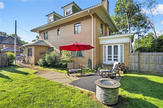 510 7th St, Patterson Heights, PA 15010 - back of property featuring a patio, a chimney, and brick siding